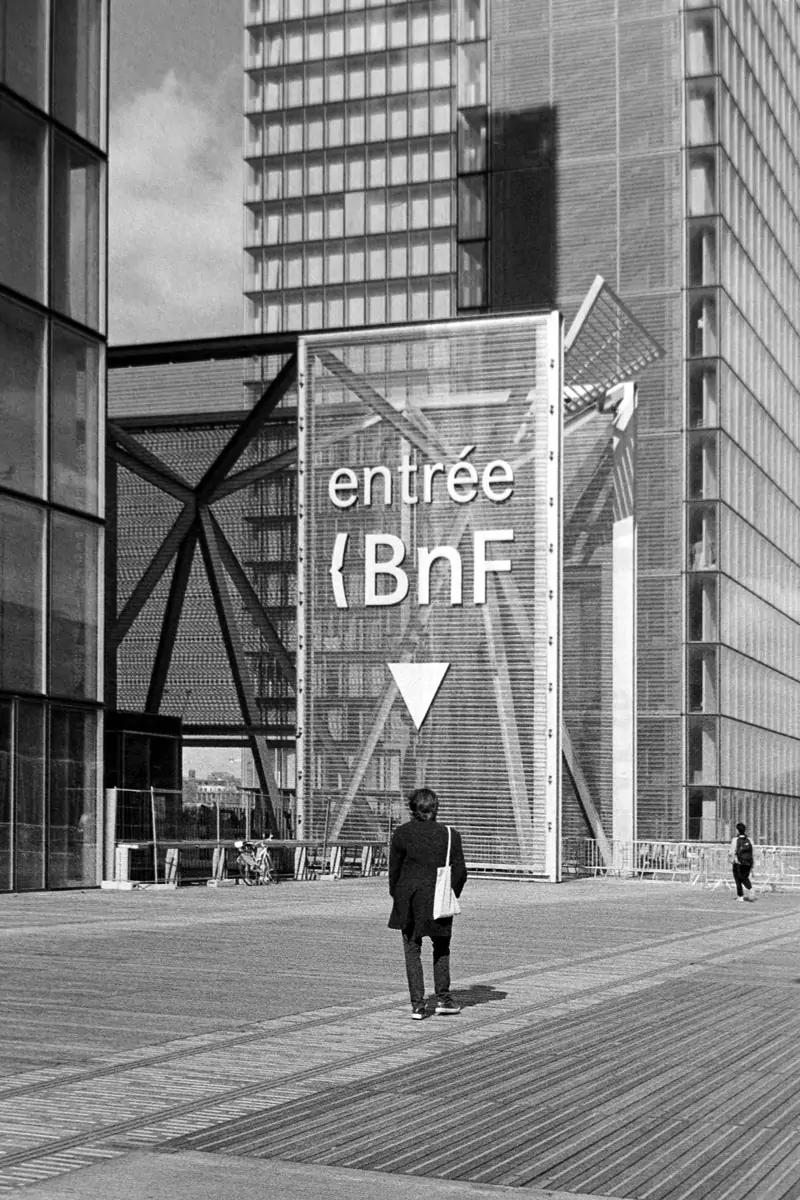 A man in front of the entrance of the BNF in Paris