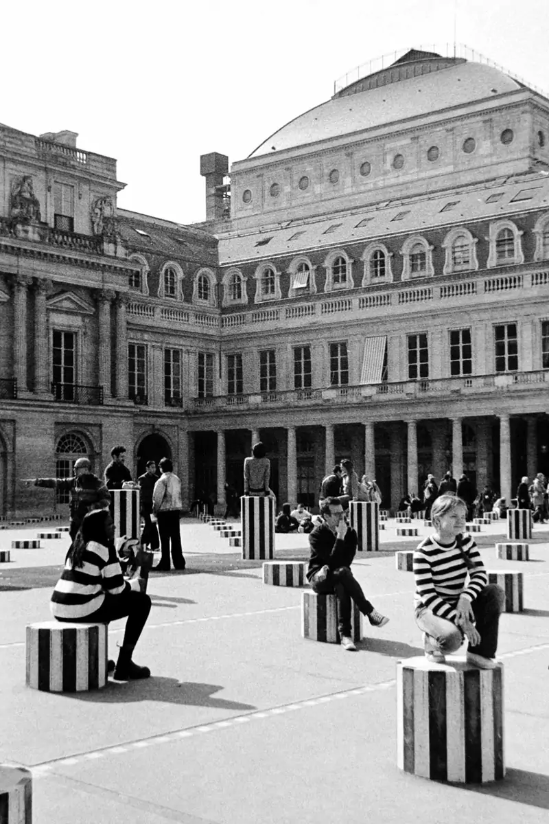 Little girl posing on Buren's
 columns in Paris
